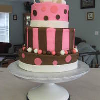 Bridal Shower 3 tier cake 10,8,6. Bottom layer chocolate, layer 2 and 3 are vanilla. Iced with buttercream with fondant accents.