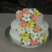 My First Wedding Cake This is a pina colada cake with a crushed pineapple filling. The flowers are 23 RI petunias in all. icing is buttercream. I want to that...
