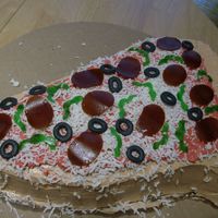 Pizza Cake Pizza cake made with fondant, buttercream and fruit rollups.Two layer cake filled with lemon buttercream