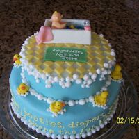 Rubber Duck Baby Shower Cake For my brother's baby shower. WBH white cake with raspberry filling and mmf. Baby and ducks made of candy clay. Bathtub is white...