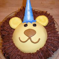 Lion Cake Chocolatecake in dancing daisy pan and sportsball pan. covered with chocolate buttercream and fondant