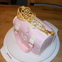 Pink Bag With Golden Tiara chocolate cake with chocolatebuttercream and covered in fondant. tiara is royal icing