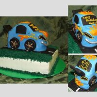 Hot Wheels Birthday Cake Car is wasc with strawberry cream filling covered in MFF. Royal icing used for flame details. "Road" base was carrot cake with...