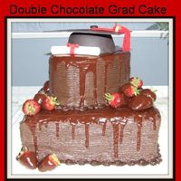 College Graduation Cake Chocolate cake with hershey syrup frosting and chocolate glaze. Cap and diploma made of gumpaste.