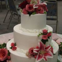 My First Wedding Cake This is a wasc (with no almond, per the bride) and raspberry filling with buttercream icing. Flowers are fresh.