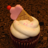 Ice Cream Cone Cupcake All buttercream with fondant ice cream cone.