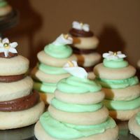 Bridal Shower Cookies saw these on here and had to try them!sugar cookies stacked with buttercream-topped with candy clay flowers