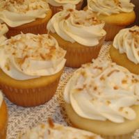 "aloha" Cupcake One of my most requested.... (white cake, pineapple and cream filling, topped with bc and toasted coconut) Its like vacation in a ...liner...