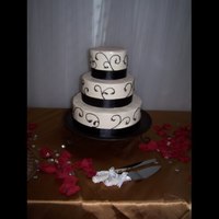 Black Scrolls Wedding Cake Simple and elegant wedding cake. Tiers are 6, 9 12 inch rounds with buttercream and black scrolls.