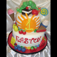 Very Hungry Caterpillar This was definately a fun cake to do. This was for a little boy's first birthday. Cake is covered in fondant and all the accent pieces...