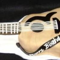 Guitar Cake Cake for a friend's birthday - chocolate cake with vanilla buttercream filling - fonadant covered.