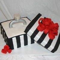 Proposal Ring Box made to look like a local jewelers box. The guy who ordered the cake used it to propose to his girlfriend! Fondant stripes and bow....