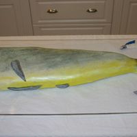 Mahi Groom's Cake This cake was over 3 1/2 feet long! I handpainted the "skin" and used piping gel for the eye. Fins, hook, and lures are MMF.