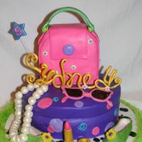 Sydney's Fancy Nancy Cake Hat box and purse are cake. Accessories done in fondant and gumpaste. The party theme was Fancy Nancy.