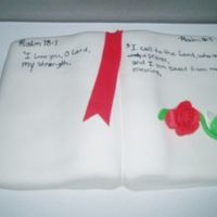 Carved Bible Cake 9x13 carved into the shape of a book covered with fondant. I used an edible marker to write the Bible verse and made a rose to add...