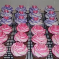 Princess Cupcakes For a 2yr old Birthday. Pink and purple swrirled cupcakes with pink shimmer fondant crowns.