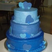 Two Hearts Cascading Blues with fondant heart cutouts.