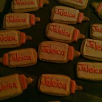 Baby Bottles Sugar cookies with color flow icing and I melted banana split taffy for the nipple