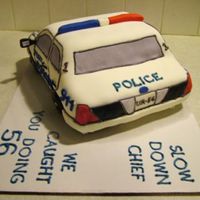 Police Car 3 Another view of my first all-fondant cake. Well, except for the wheels, which are chocolate doughnuts.