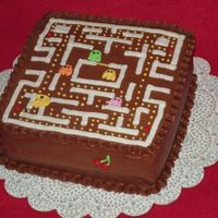 Pacman Cake 8 inch square yellow cake with chocolate buttercream icing.