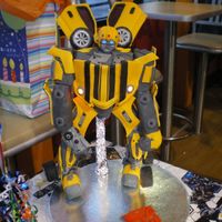 Ultimate Transformer This cake was donated for a special little boy. The eyes, headlights, fog/side lights, and "gun" are wired with lights. Window...