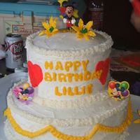 Mickey Mouse Tiered Cake My daughter loved mickey mouse and want a mickey mouse cluibhouse party for her birthday so I made her this 2 tiered round cake with bc...