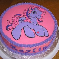 P1010034.jpg My daughters 4th birthday cake. Color flow was done with #1 tip - will use #3 next time, lol. Rainbowlicious cake with raspberry BC and...