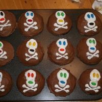 Skull And Crossbone Cupcakes These cupcakes go with my treasure chest cake! Simple BC cupcakes with skull and crossbone and M&M's for eyes/mouth