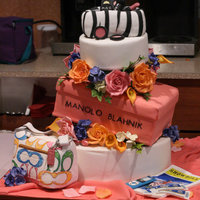 Designer Topsy Turvy This is a topsy-turvy cake I made for a bridal shower. The client has rainbow colors involved in her wedding scheme, so I couldn't...