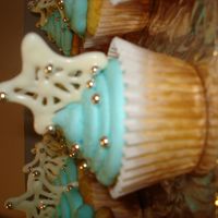 Cosmetic Gala Cupcakes Cupcakes for the Christmas Gala we had at work. Vanilla cake with buttercream icing and a piped chocolate star with silver dragees and...