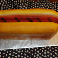 First Sculpted Cake - Hotdog Hotdog cake half sheet, cut and stacked and carved. Covered in MMF, and then airbrushed.