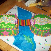 Dora The Explorer 7in square cake, 8in round cake. bridge was made of colored mini popsicle stickes glued to yarn connected to painted chopstickes with hot...