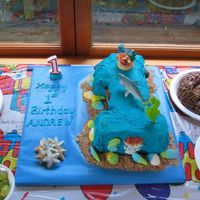 1St Birthday Cake Sea Theme This was my nephews first birthday cake that I made using buttercream. The sand is cinnamon wafers crushed and I used seashell sweets, (new...
