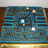 Pac Man Video Game called Pac Man. Used black rolled fondant and buttercream for the decorations.