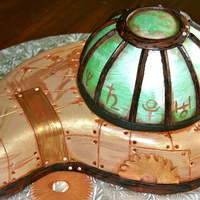 Steampunk Emerald A birthday cake for a friend born in May. She loves steampunk. Covered in a 50/50 fondant/candy clay mix. Chocolate cake with cookies and...