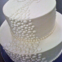 Bubbles This was a last minute cake for my husbands office, but it looks like it could be a wedding cake. Buttercream icing with royal icing dots...