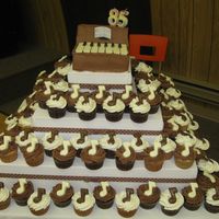 Music Cupcake Tree This cupcake tree was for my Great-Aunt's 85th Birthday. The piano on top is cake with BC icing, keys are made of chocolate. Cupcakes...