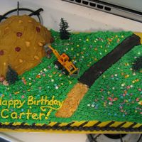 Construction Cake my first paid cake order! yellow 1/2 sheet w Devil's food mountain. BC and fondant/candy accents