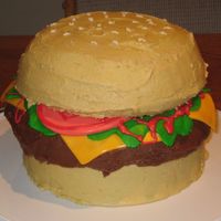 Huge Hamburger This was a cake I made for my husband and his co-workers. The giant hamburger was made up of two 7 inch rounds for the buns and a 8 inch...