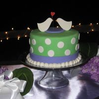 Love Bird Wedding Cake I made this cake for my brother's wedding. They wanted something fun and nontraditional. I made cupcakes with B monograms for the...