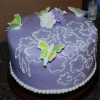 Dsc_1062.jpg Another b day cake with fondant and butterfly's.