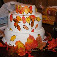 Fall Wedding Cake Three tiers, 12,10,6 with the 10" 4 layers instead of two. Painted using lemon extract and a mixture of gel and powdered icing color...