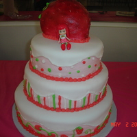 Strawberry Shortcake Birthday 12 inch, 10 inch, 8 inch round, stacked. buttercream with fondant. strawberry is ball cake carved, covered in buttercream and sprayed w red...