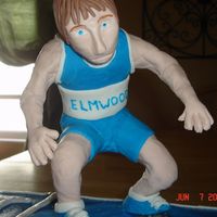 Wrestler this is the wrestler i made that went with the grad cake. The pic didnt show him very well. there is a metal bendable piece inside to hold...