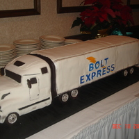 Semi Truck Cake 10 9 x 13 cakes makes up the cab and trailer. Cab is cut out. Trailer is stacked cakes. Tires made from rice cereal treats covered in...