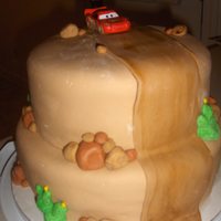 Lightn' Mcqueen This was my son's 5th birthday cake. It is chocolate cake with buttercream icing and homemade marshmallow fondant. It was a huge hit!...