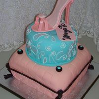Stiletto On Pillows Made for a teen's birthday party. Gumpaste stiletto sat atop two cake tiers. Pillow was covered in fondant, with chocolate trim and...