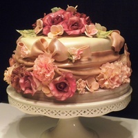 Lovely.... This is a design for a wedding shower. All fondant & gum paste flowers. The inspiration was High Tea in an English Garden. TFL!