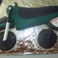 Dirt Bike Cake This was for a young mans 7th birthday. I attached the handlebars when I delivered. He and his family loved it.......I was not completly...