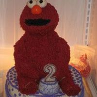 Elmo 12 inch round on bottom, 8 inch round + wonder mold for his body, rice krispy treats shaped with ball pan for the head, shaped rice krispy...